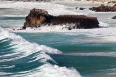 A picture of the waves and rocks in the Algarve, Portugal.