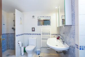 En-suite bathroom. With double sink, toilet, separate shower and small bath. Towel heater and hair dryer