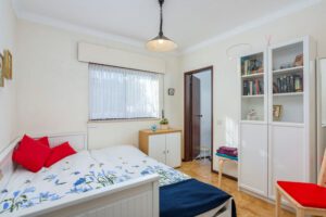 Extended sofa bed for 2 people. Closet space with books. This shares the family bathroom.