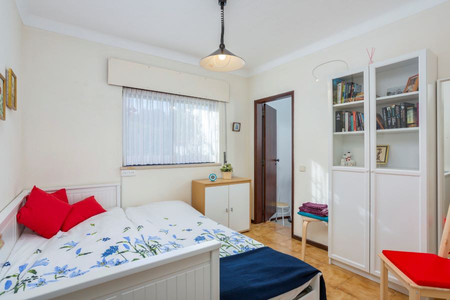 Extended sofa bed for 2 people. Closet space with books. This shares the family bathroom.