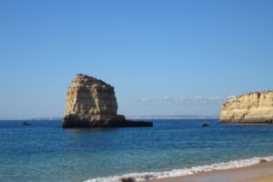 Fine sandy beaches on the rocky coast of the Algarve, Portugal. Safe swimming, surfing and sunbathing.
