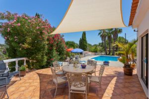 Outside terrace with shade cloth and access to the pool. Your dog is also welcome