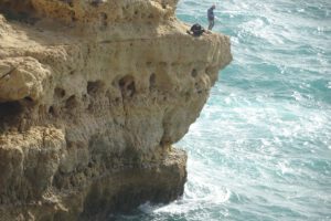 Dangerous fishing on Algarve rocky coast